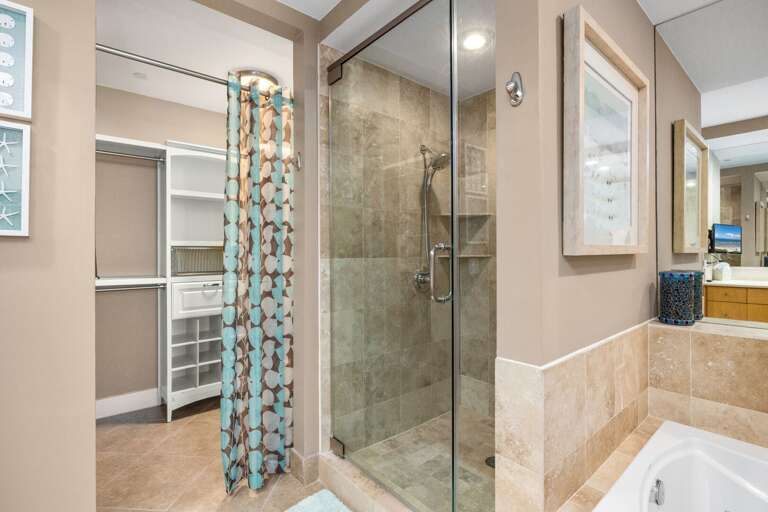 Refresh in the spacious primary bath with soaking tub and walk-in shower