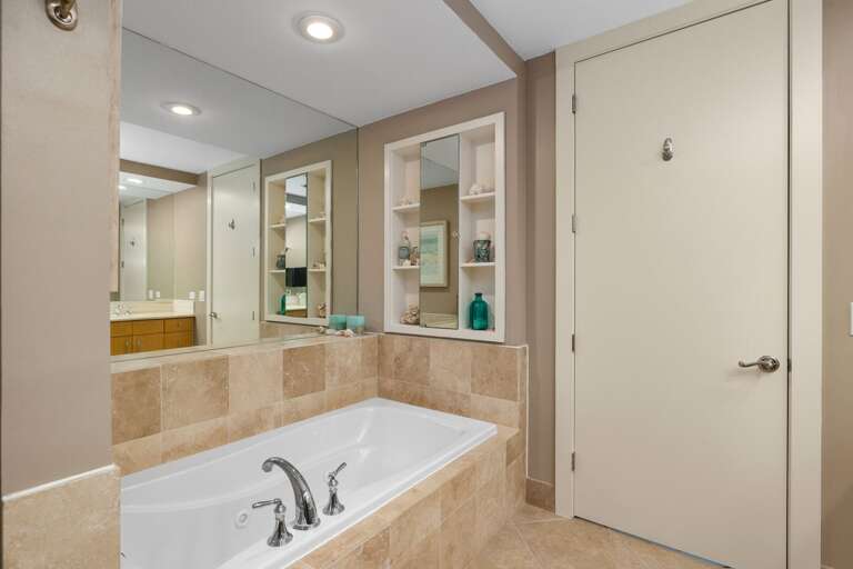 A spa-inspired primary bath designed for relaxing after beach days