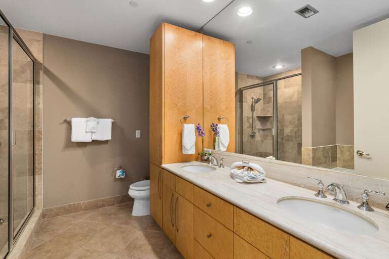 Spacious shared bathroom with walk-in shower and plenty of counter space