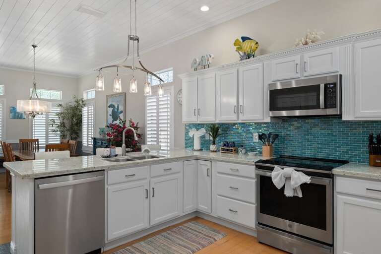 The beautifully updated kitchen is fully equipped for everything from quick breakfasts to family feasts.