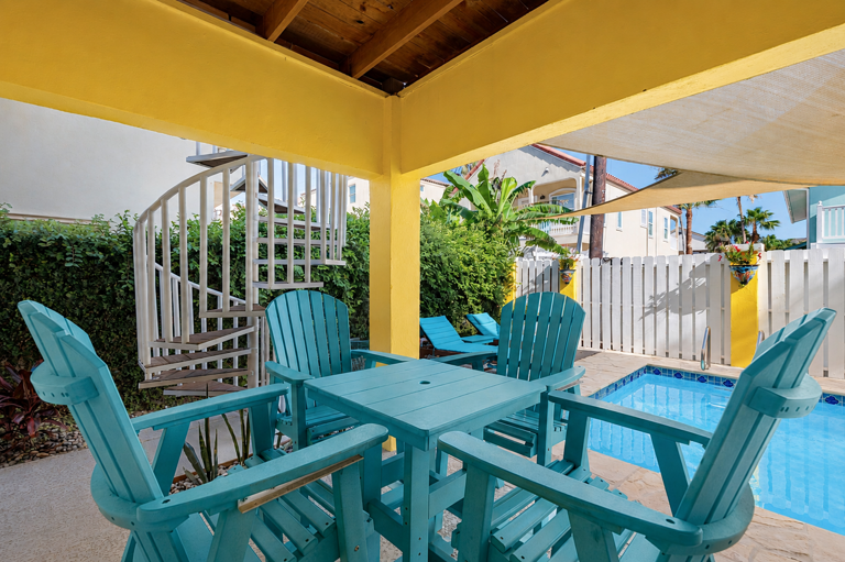 Enjoy outdoor dining in your poolside oasis.