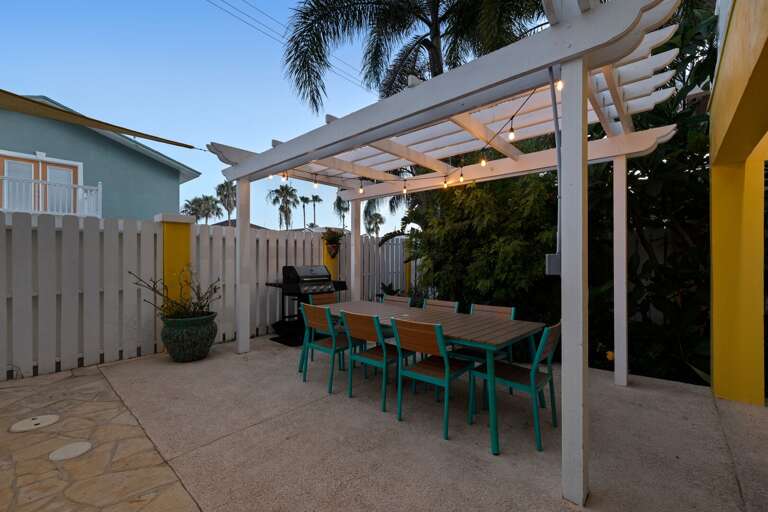 Fire up the grill and enjoy outdoor dining in your private backyard retreat.