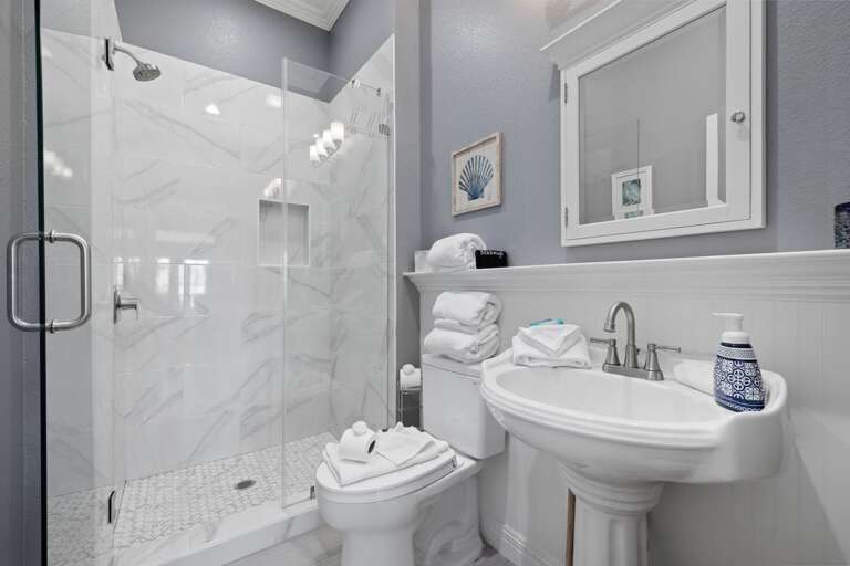A full bathroom just off the living area adds extra convenience for everyone.