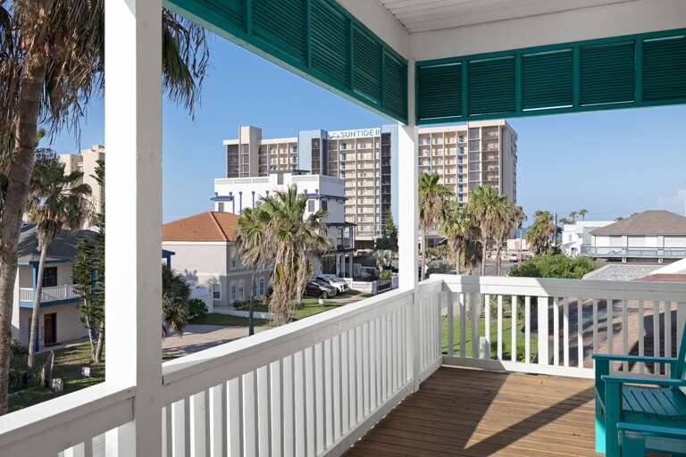 Take in neighborhood views while relaxing on the covered upper-level balcony