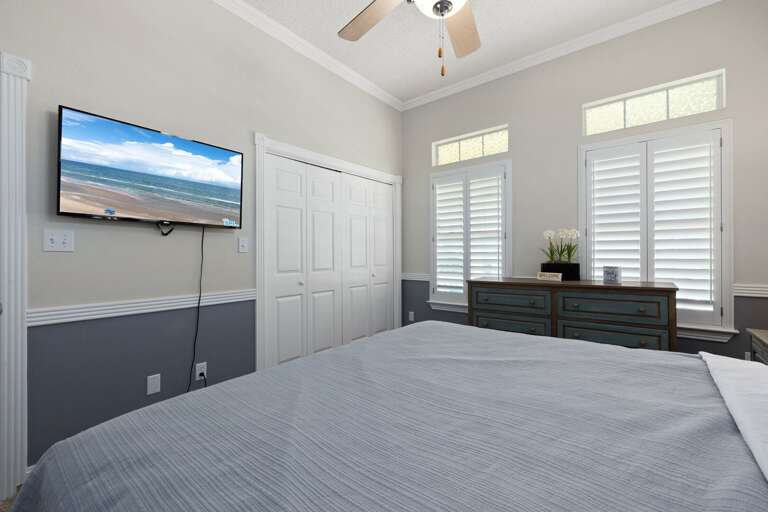 Spacious king guest room with TV.