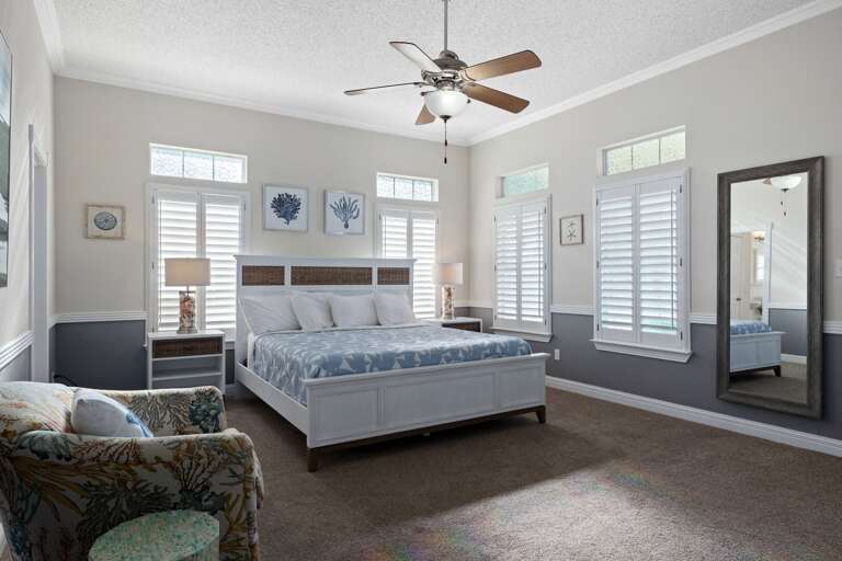Your spacious primary suite features a plush queen bed and plenty of room to unwind after a fun-filled day. (Sleeps 2)