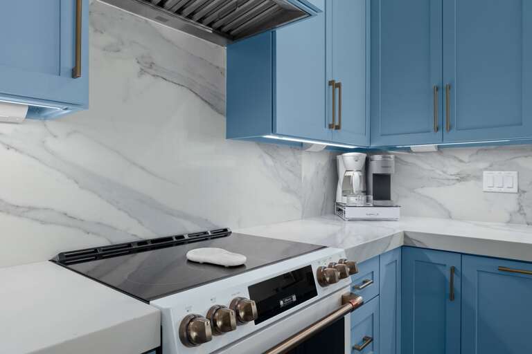 Prepare your favorite meals with ease using the modern gas range and spacious kitchen countertops.