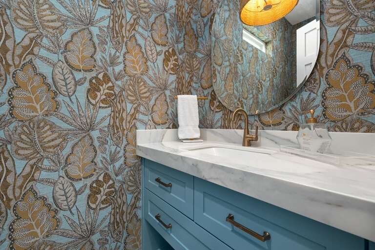 The stylish half bathroom just off the entryway and kitchen.