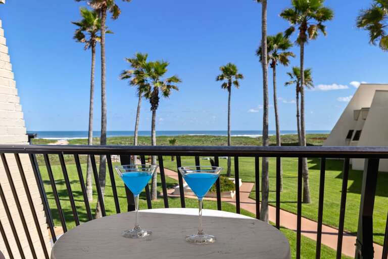 Sip your favorite drink on the private balcony while enjoying beautiful Gulf views and swaying palm trees