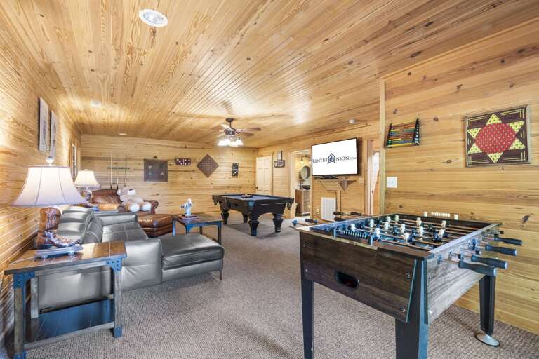 Wood-paneled Living Room With Games And Television In Vacation Rental