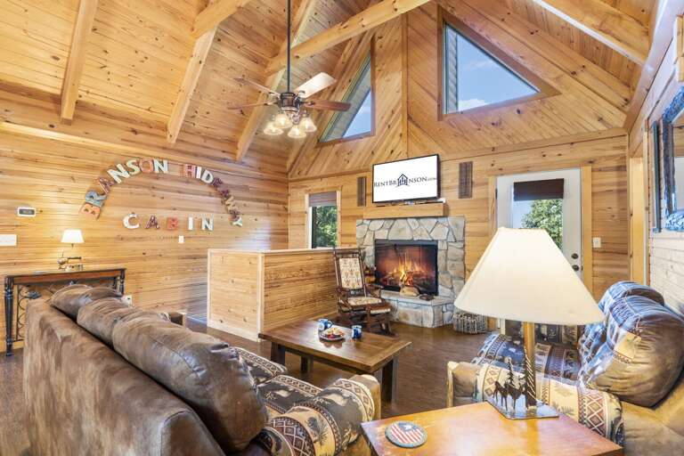Rustic Cabin Living Room With Fireplace And Wooden Interiors