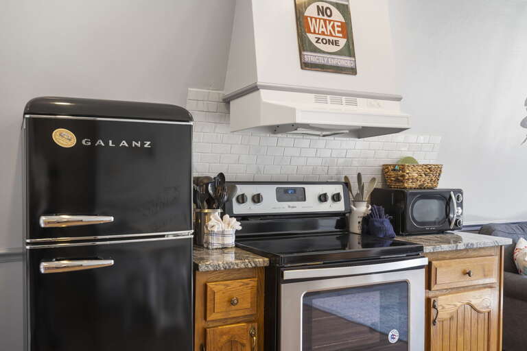 Kitchen Interior With Black Retro Refrigerator And Stove