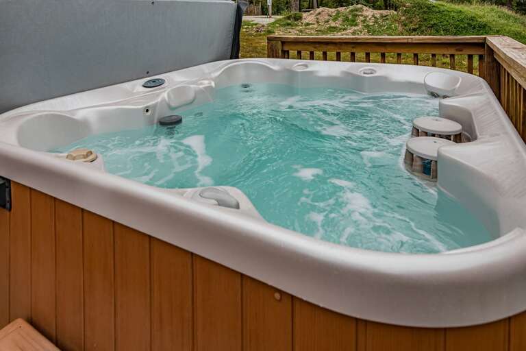 Soak in your hot tub while taking in breathtaking Ozark views