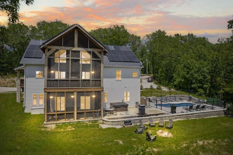 Two-story House With Patio And Sunset Sky Two-story House With Patio And Sunset Sky