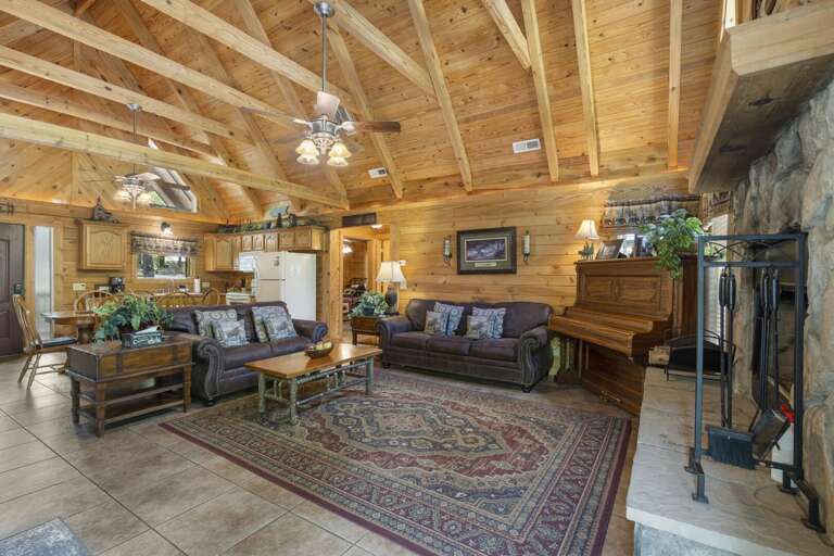 Rustic-style Interior With Wooden Beams, Furniture, And Fireplace
