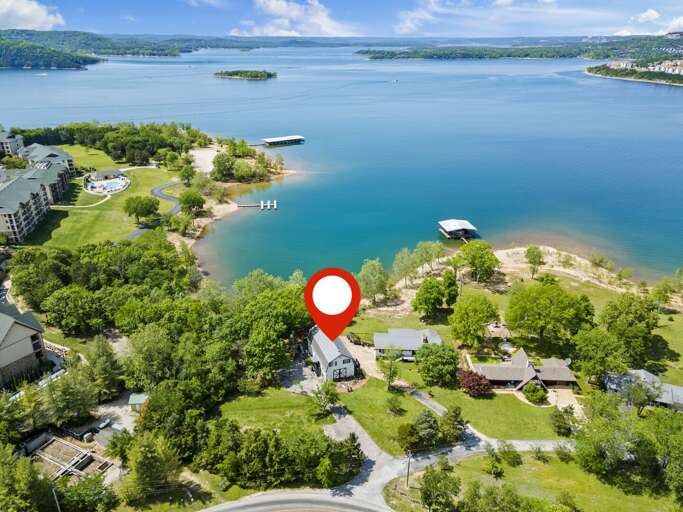 Aerial View Of Lakeside Buildings With Red Location Marker