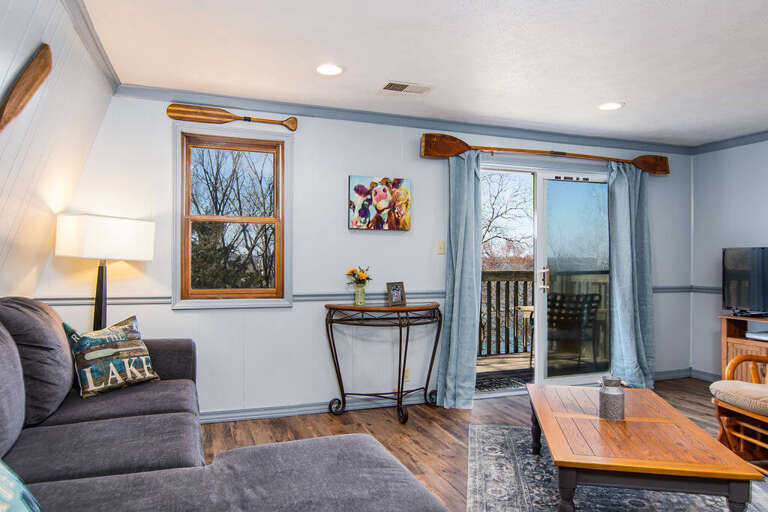 Living Room Interior With Furniture And Sliding Door Leading To Balcony