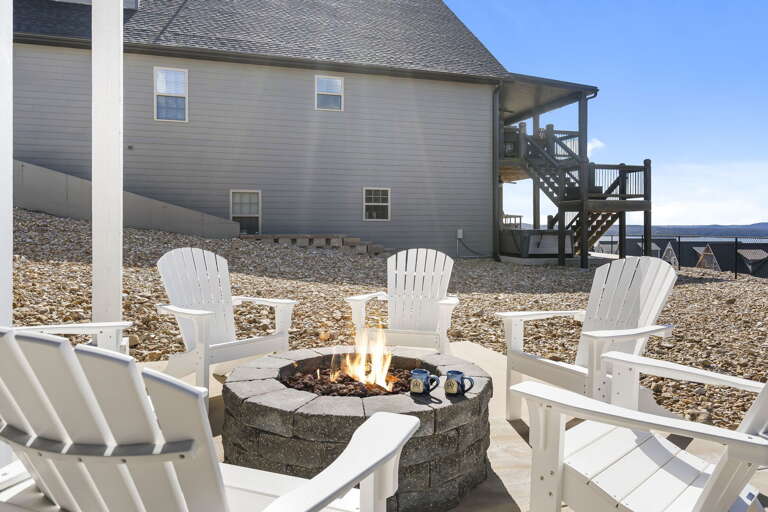 Outdoor Seating Area With Fire Pit And Building In Background Outdoor Seating Area With Fire Pit And Building In Background