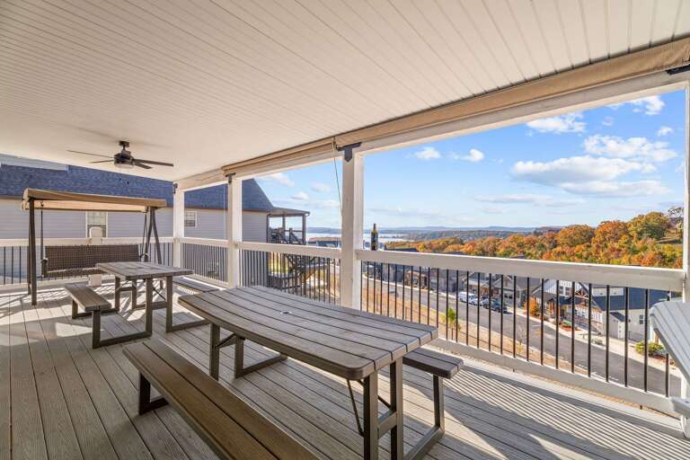 Spacious Patio With Picnic Tables Overlooking Scenic Lake