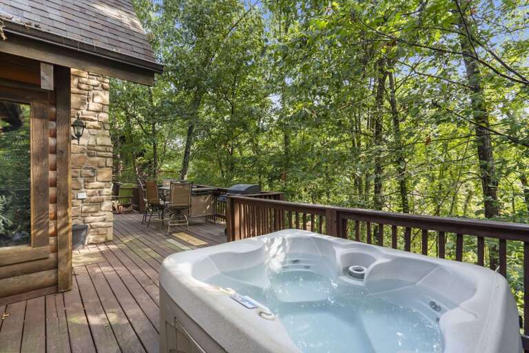 Outdoor Hot Tub On Wooden Deck Surrounded By Trees Outdoor Hot Tub On Wooden Deck Surrounded By Trees