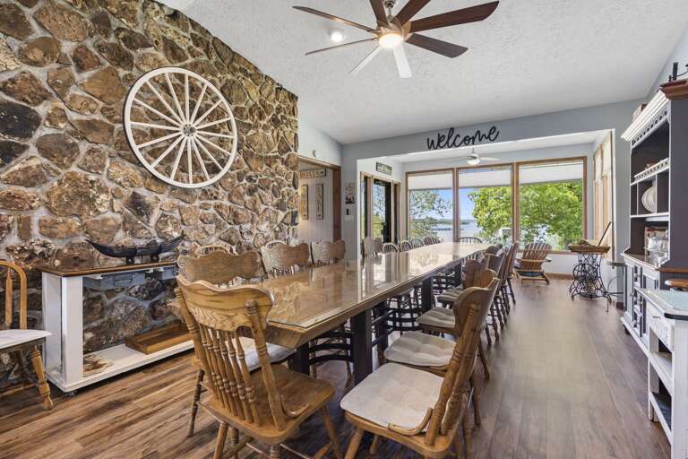 Interior Dining Area With Stone Wall And Wooden Table Interior Dining Area With Stone Wall And Wooden Table
