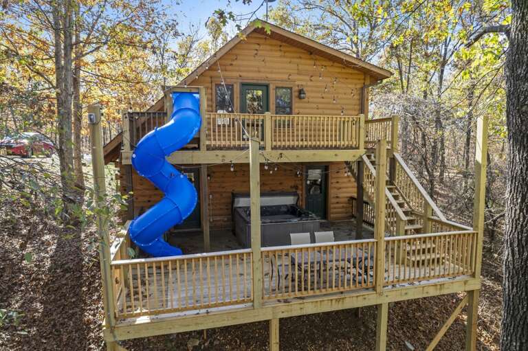 Wooden House With Blue Slide Nestled In Nature Wooden House With Blue Slide Nestled In Nature
