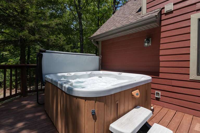 Outdoor Hot Tub On Deck Surrounded By Trees