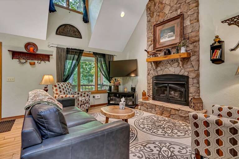 Living Room With Fireplace And High Ceiling