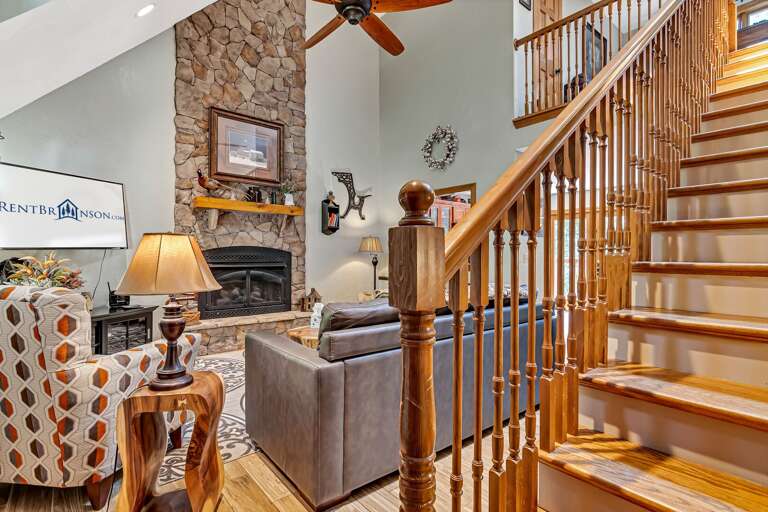 Interior Living Space With Staircase And Fireplace