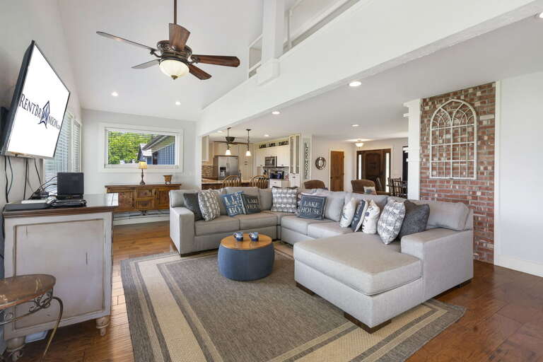 Living Room Interior With Sectional Sofa And Open Kitchen Area Living Room Interior With Sectional Sofa And Open Kitchen Area