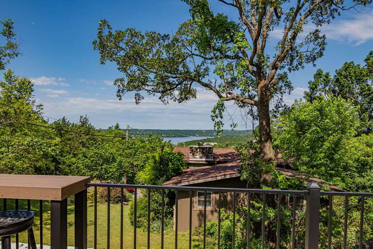 View From Balcony Overlooking Trees And A Lake View From Balcony Overlooking Trees And A Lake