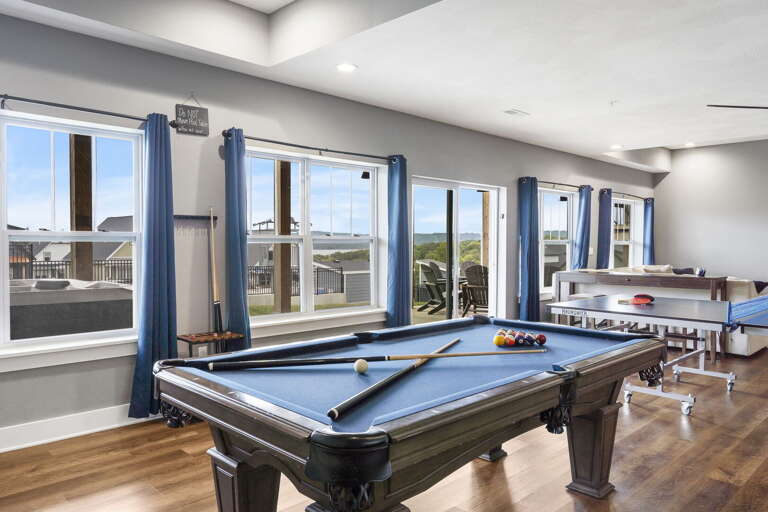 Game Room With Pool Table And Shuffleboard In Vacation Rental