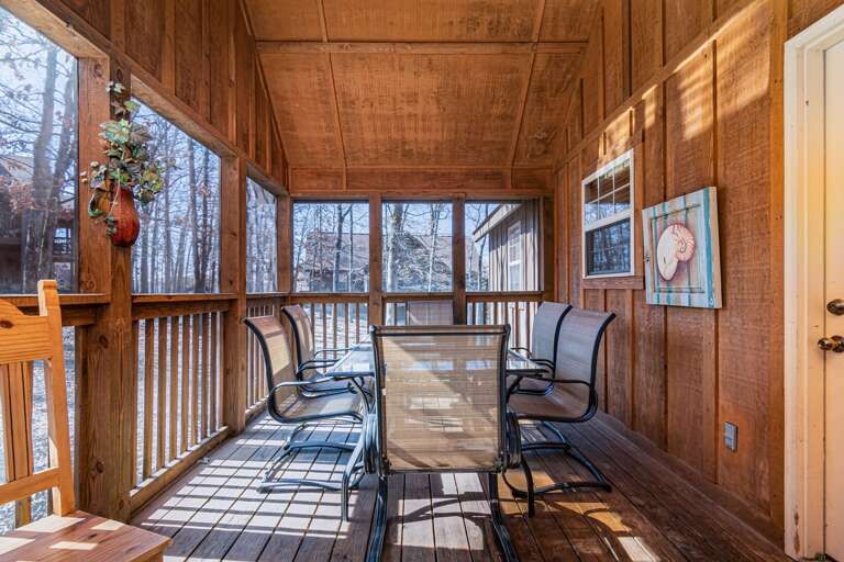 Vacation Rental Screened Porch With Table And Chairs