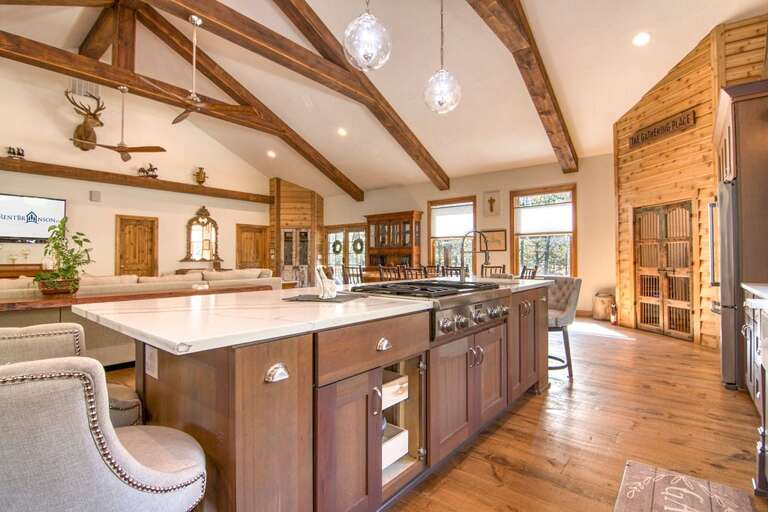 Rustic Kitchen Interior With Island And Wooden Beams