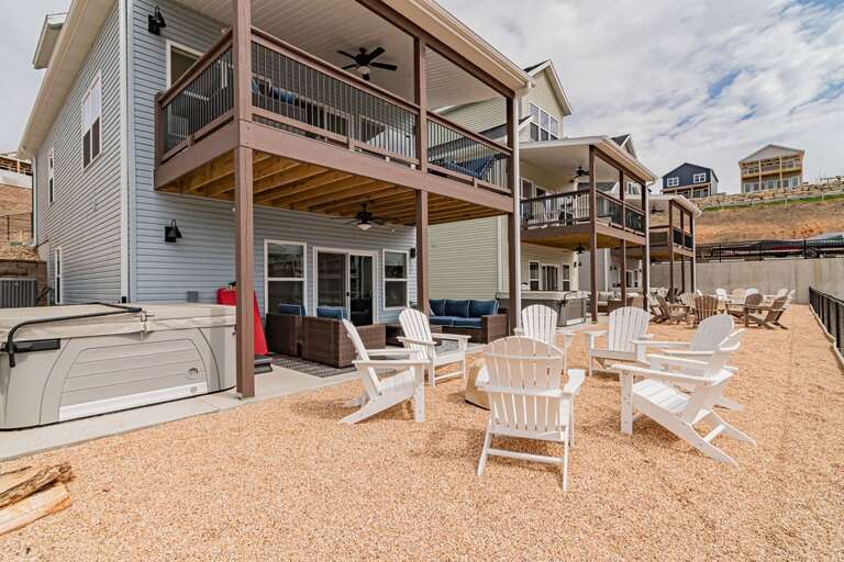 Patio With Chairs And Hot Tub At Vacation Rental