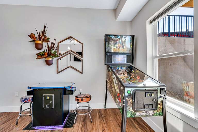 Interior With Pinball Machine, Arcade Game, And Wall Decor Interior With Pinball Machine, Arcade Game, And Wall Decor