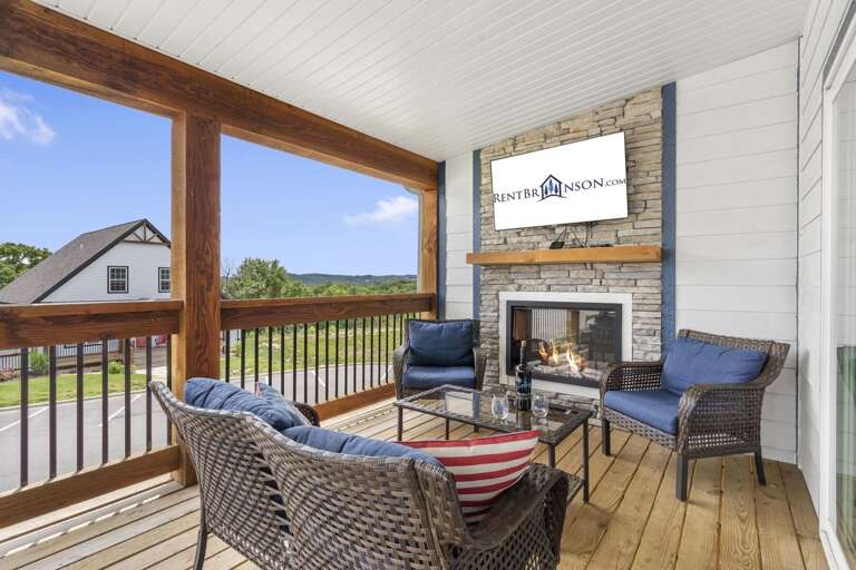 Outdoor Balcony With Seating Area And Fireplace