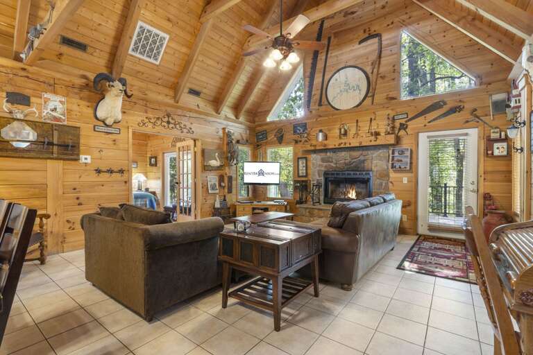 Rustic Living Room Interior With Fireplace And Wooden Walls In Vacation Rental Rustic Living Room Interior With Fireplace And Wooden Walls In Vacation Rental