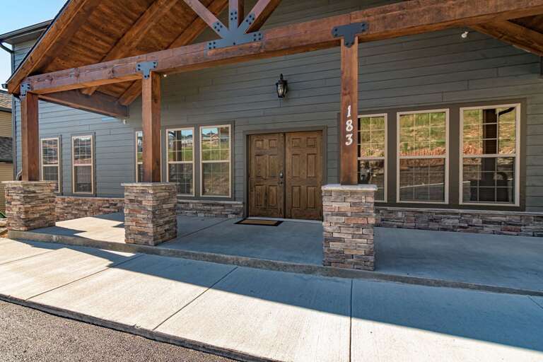 Building Exterior With Wooden Beams And Stone Columns