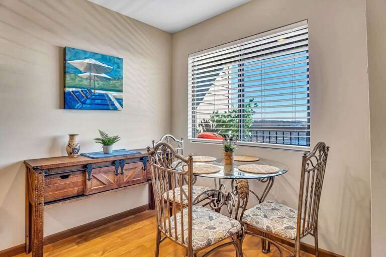 Dining Area With Table, Chairs, And Window Blinds Dining Area With Table, Chairs, And Window Blinds