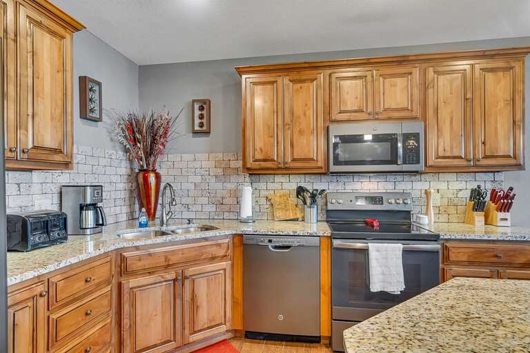 Wooden Cabinets In Kitchen With Stainless Steel Appliances Wooden Cabinets In Kitchen With Stainless Steel Appliances