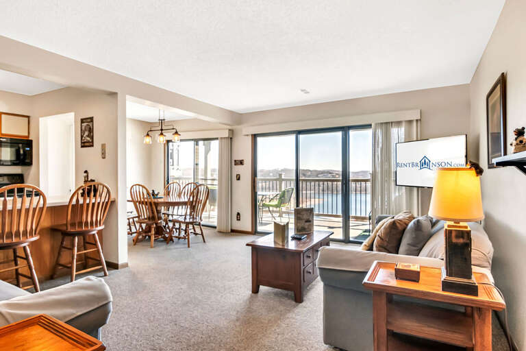 Interior Living Space With Furniture And Balcony Access Interior Living Space With Furniture And Balcony Access