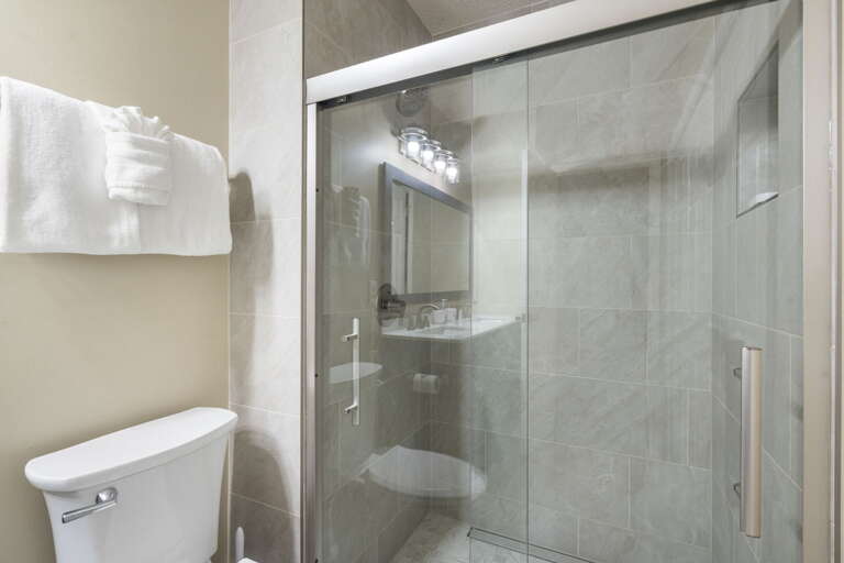 Polished Private Bathroom, Bright Bulbs, Pristine Porcelain