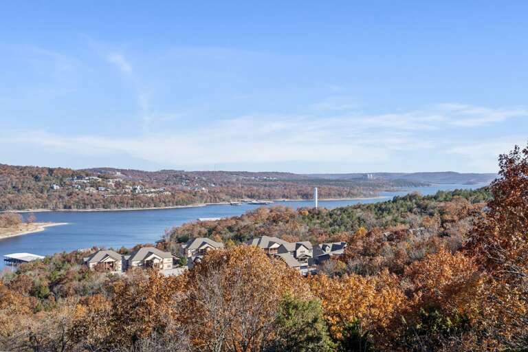 Scenic View Of River, Foliage, And Residential Buildings Scenic View Of River, Foliage, And Residential Buildings