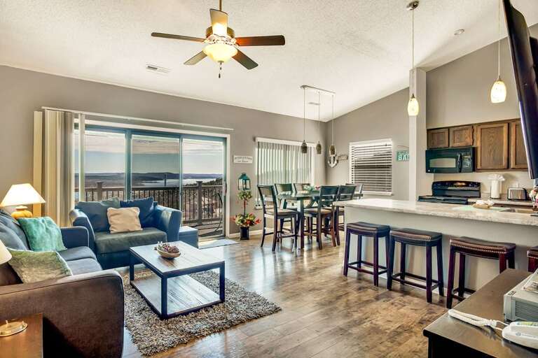 Living Room With Kitchen, Dining Area, And Balcony View Living Room With Kitchen, Dining Area, And Balcony View