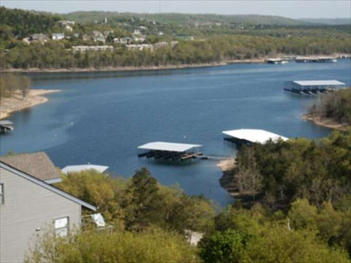 Lake View With Floating Docks And Surrounding Greenery
