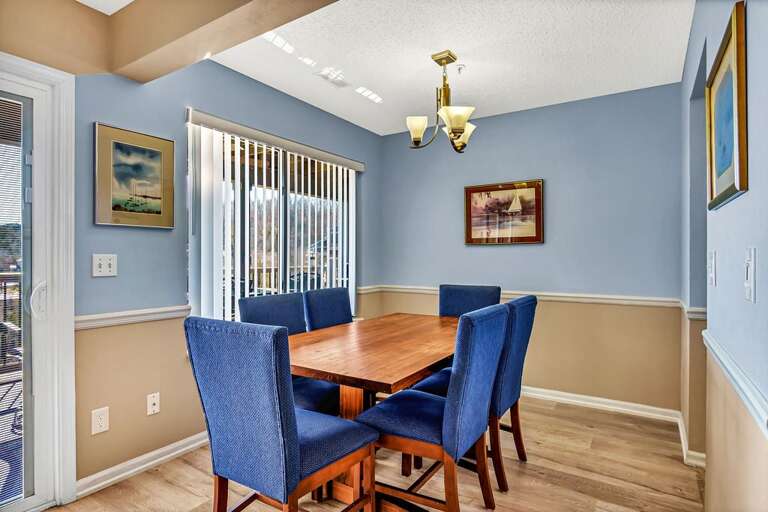 Dining Room With Blue Chairs And Wooden Table Dining Room With Blue Chairs And Wooden Table