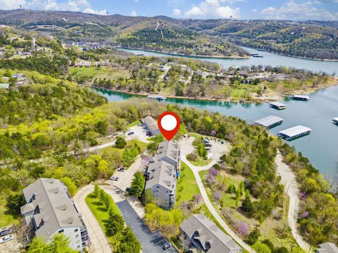 Aerial View Of Vacation Rental With Red Marker Near Lake Aerial View Of Vacation Rental With Red Marker Near Lake