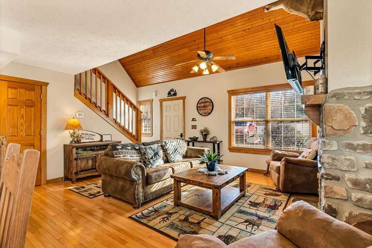 Living Room Interior With Stone Fireplace And Staircase Living Room Interior With Stone Fireplace And Staircase