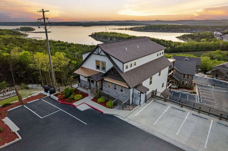 Aerial View Of Lakeside Vacation Rental At Dusk Aerial View Of Lakeside Vacation Rental At Dusk